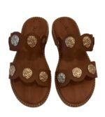 Handmade brown leather sandals with decorative metal elements from the company VCSTAFA